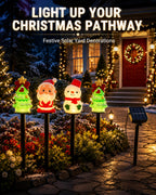 Christmas solar pathway stake lights decorating a front yard at night