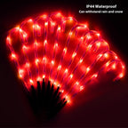 IP44 red LED candy cane pathway lights glowing outdoors at night