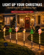 Christmas solar pathway stake lights decorating a front yard at night