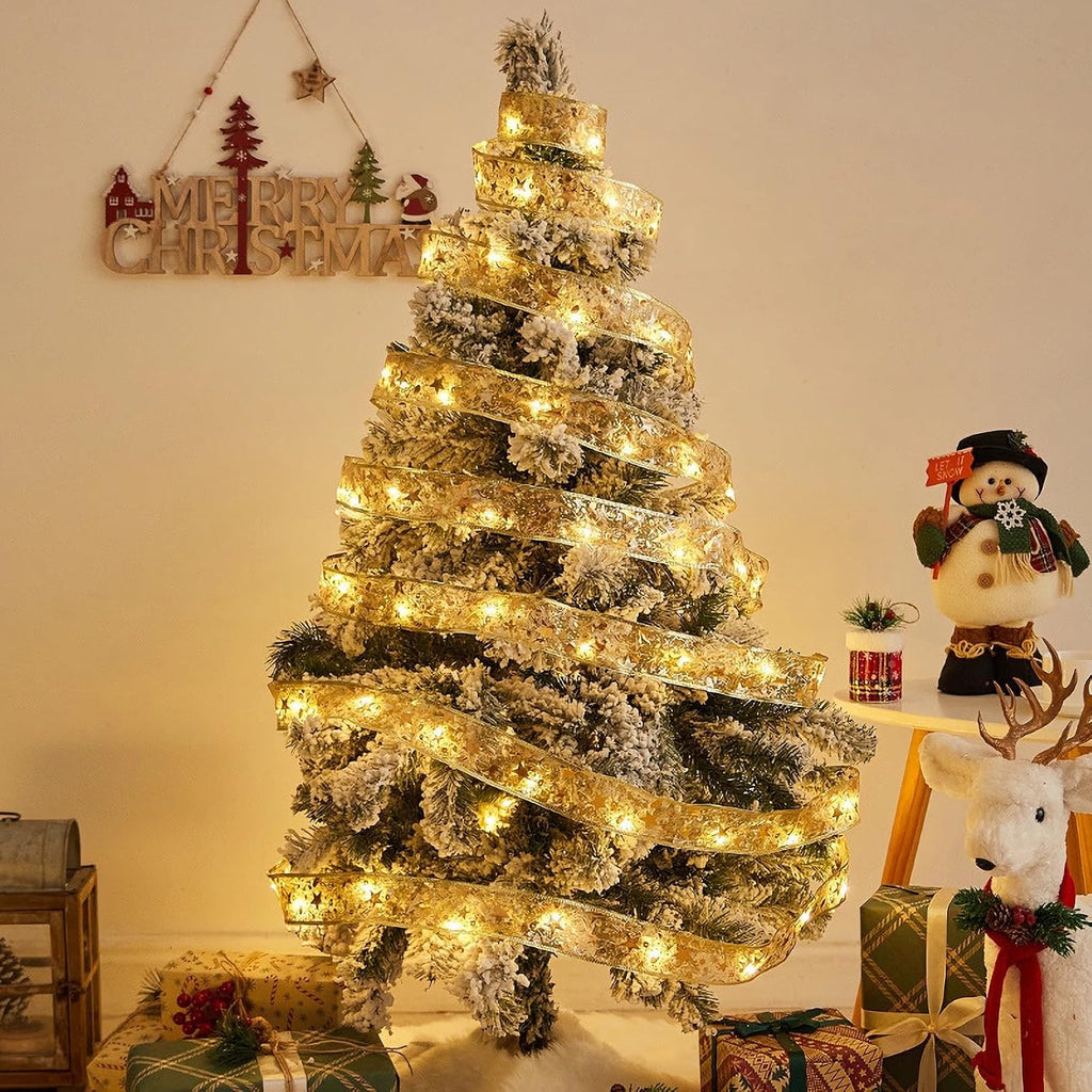 Gold ribbon fairy lights wrapped around a decorated Christmas tree